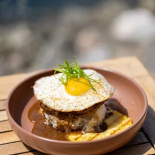 weekend breakfast and brunch Loco Moco egg on top of beef patty with gravy and griled pineapple