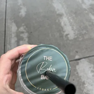 a person holding a cup of coffee