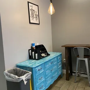 a blue dresser in a kitchen