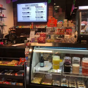 Counter with juice selections and hot food menu