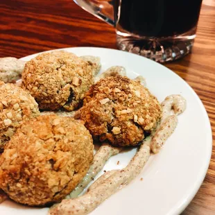 a plate of food and a glass of beer