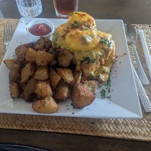 Chorizo eggs Benedict with fried potatoes