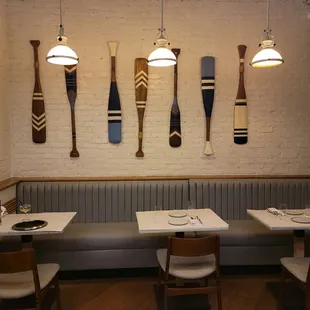 a row of paddles hanging on the wall