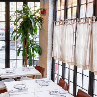 a dining room with tables and chairs