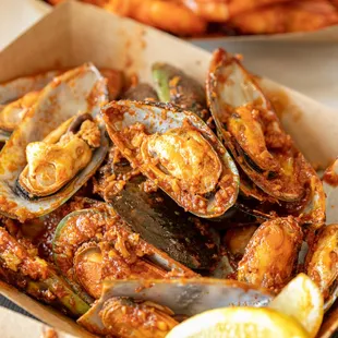 a box of cooked mussels