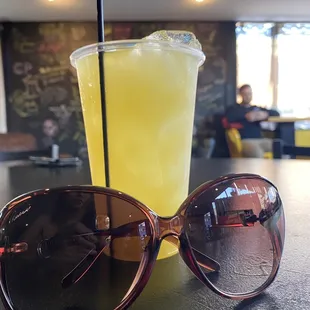 a drink and sunglasses