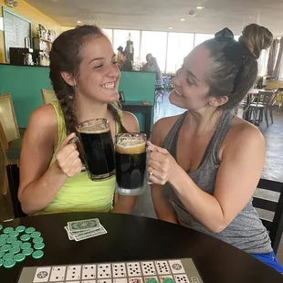 two women drinking beer