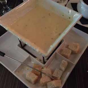 Nasty chopped up sandwich bread with melted sliced sandwich cheese, worst fondue ever for $18