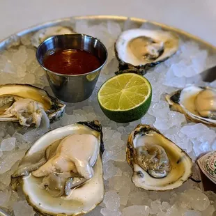 a plate of oysters on ice