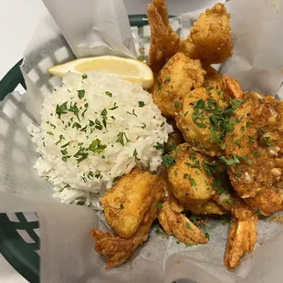 a basket of fried shrimp and rice