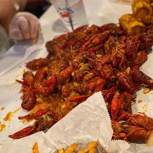 the crawfish and fries on the table