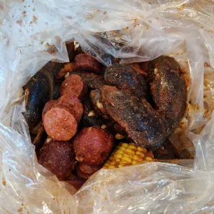 Mussels, sausage, corn and potatoes