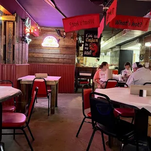 people sitting at tables in a restaurant
