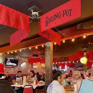 people sitting at tables in a restaurant