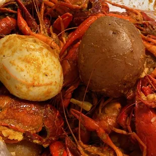 a bowl of craws and potatoes
