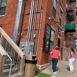 a woman walking down the sidewalk