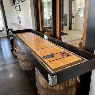 a shuffler table and barrels