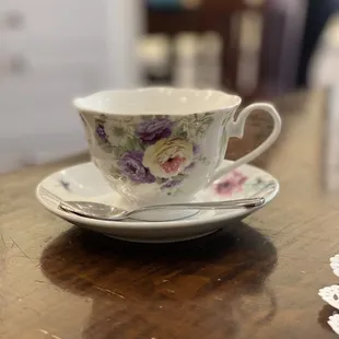 a cup and saucer on a table