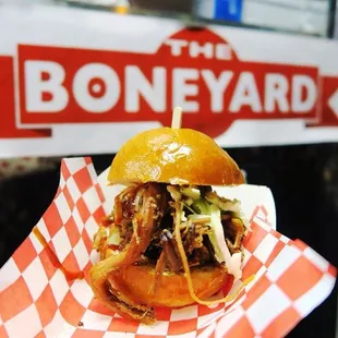 a pulled pork sandwich in a basket