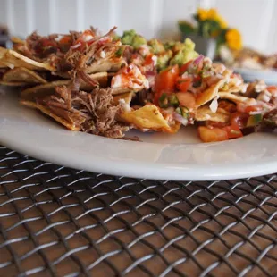 a plate of nachos on a table