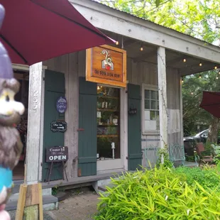 a gnome holding an umbrella