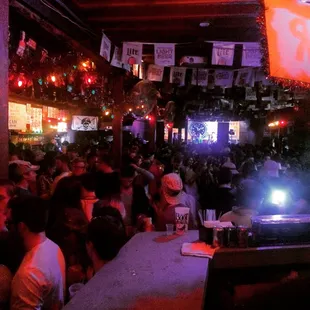 a crowd of people at a bar