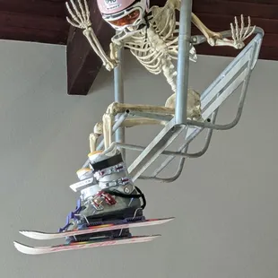 a skeleton on a ski lift