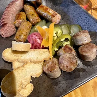 Home made sausage board with pickled veggies