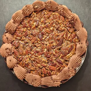 Lush and decadent chocolate pecan pie with a chocolate almond crust for Thanksgiving.