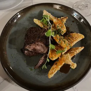8oz Strip and Tempura Sweet Potatoes My steak is cooked medium well, still very tender.