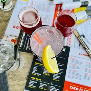 a table with drinks and menus