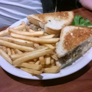 a plate of french fries and a sandwich