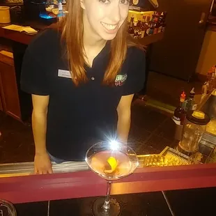 Katie's Citrus Kick 1 shot Malibu Rum, dash of Campari. float of Grenadine  1 shot Gin, juice of a Lemon Wedge. A lemon twist.