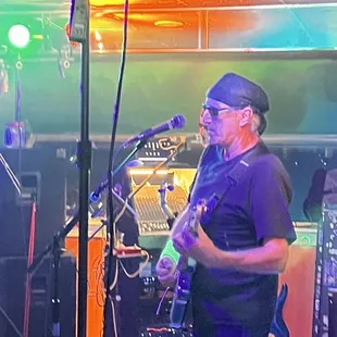 a man playing a guitar