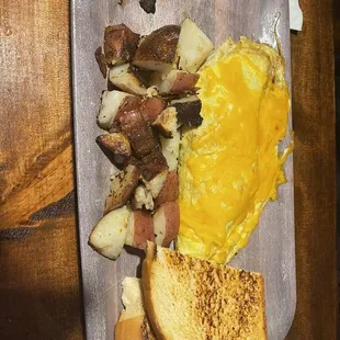 Cowboy Omelette with roasted potatoes. Half the potatoes were consumed before this photo. 5/5