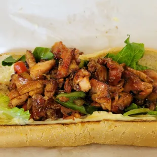 Bourbon chicken sub sandwich.  Mine is without cheese and banana peppers.