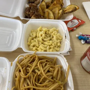Bourbon chicken and Cajun potatoes, mac n cheese, Lo mein