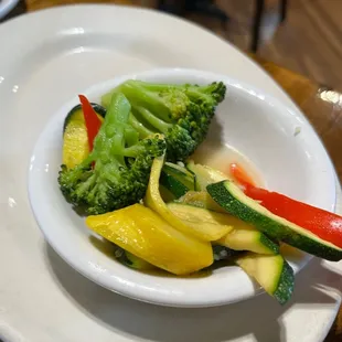 a bowl of vegetables on a plate