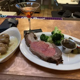 Prime rib, mushroom caps, broccolini and a Manhattan.