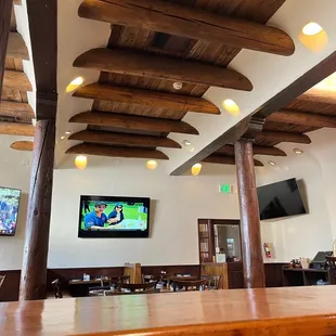 a bar with a television on the wall