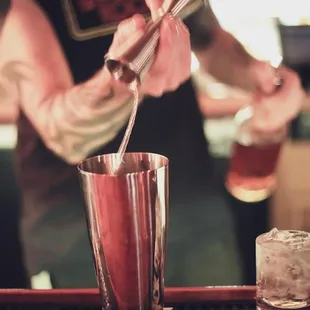 a bartender mixing a drink