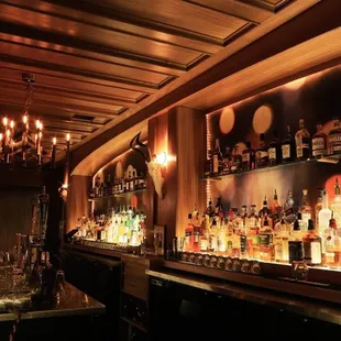 a bar with a lot of liquor bottles