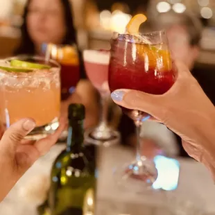 a group of people toasting drinks