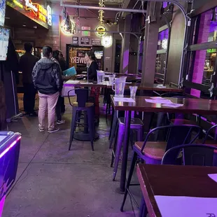 The colorful front room. 1/2 of it shown-there are 4 tables with 6 seats &amp; 1 table with 4 seats total).