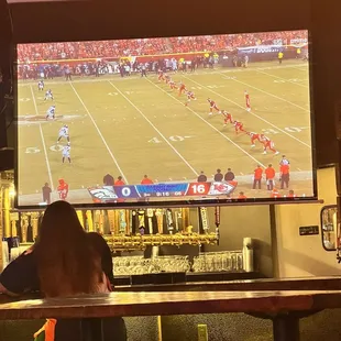 a football game being played on a big screen