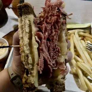 Rueben Sandwich with fries, pickle and coleslaw