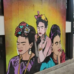 a mural of three women