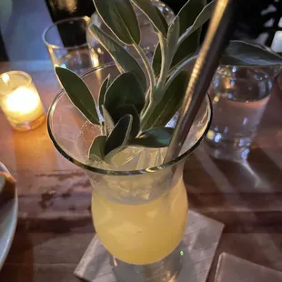 a glass of lemonade on a table