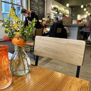 two vases of flowers on a table