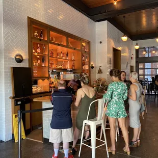 a group of people at a bar